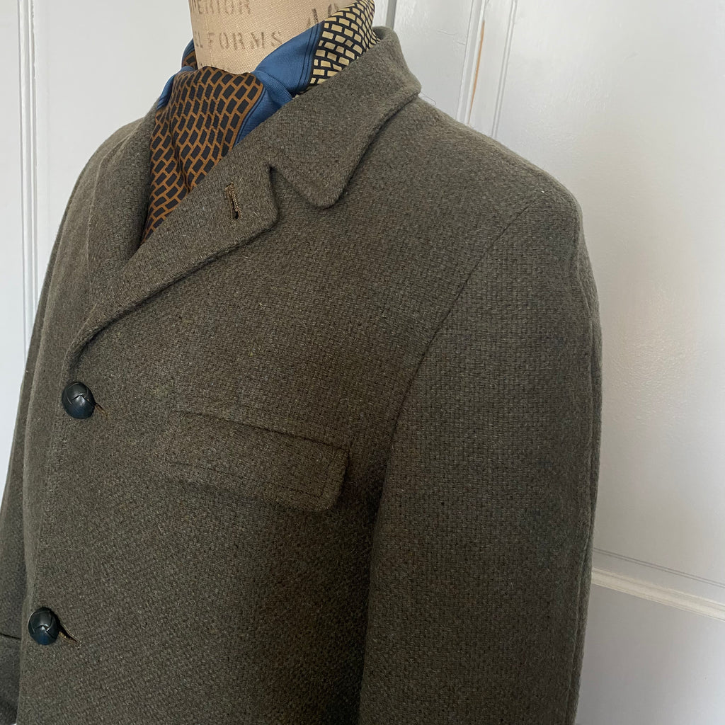 Men's vintage 1960's all wool overcoat with Barney's sale tags attached (never worn) , Amalgamated Union Made with a wool unremovable flannel lining for winter wear. Dark Olive/Grey color. Size Large 44 Regular.