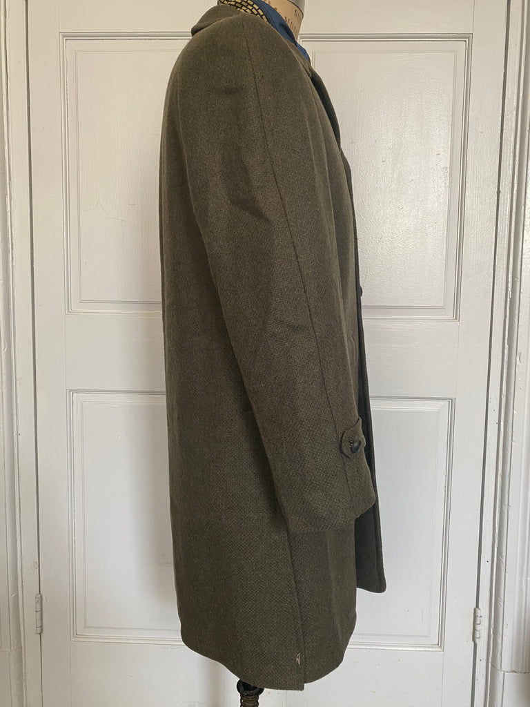 Men's vintage 1960's all wool overcoat with Barney's sale tags attached (never worn) , Amalgamated Union Made with a wool unremovable flannel lining for winter wear. Dark Olive/Grey color. Size Large 44 Regular.