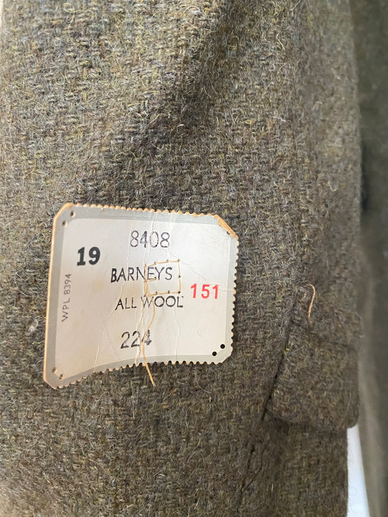 Men's vintage 1960's all wool overcoat with Barney's sale tags attached (never worn) , Amalgamated Union Made with a wool unremovable flannel lining for winter wear. Dark Olive/Grey color. Size Large 44 Regular.