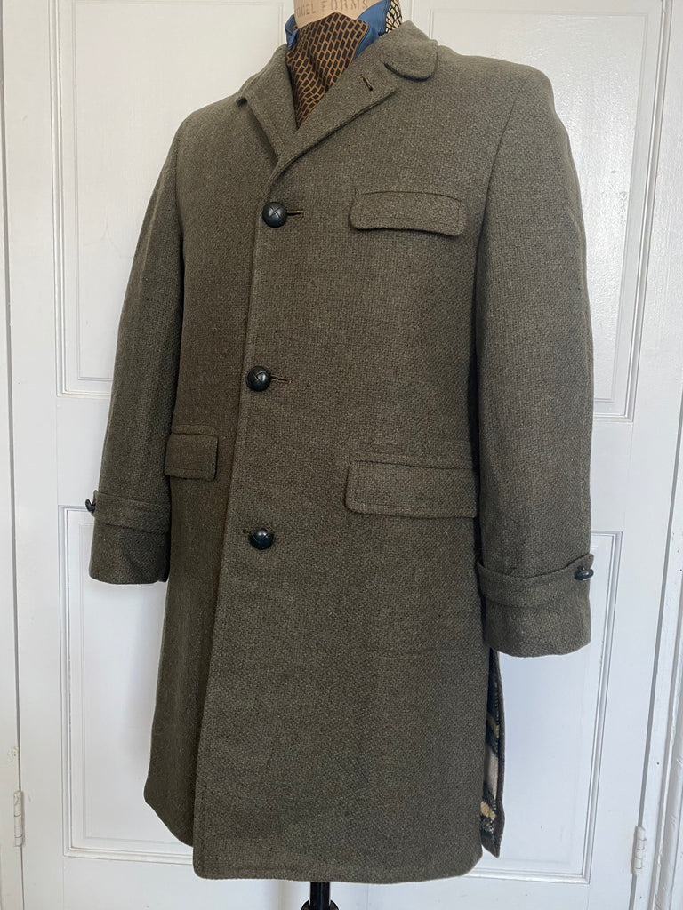 Men's vintage 1960's all wool overcoat with Barney's sale tags attached (never worn) , Amalgamated Union Made with a wool unremovable flannel lining for winter wear. Dark Olive/Grey color. Size Large 44 Regular.