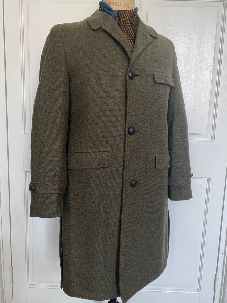 Men's vintage 1960's all wool overcoat with Barney's sale tags attached (never worn) , Amalgamated Union Made with a wool unremovable flannel lining for winter wear. Dark Olive/Grey color. Size Large 44 Regular.