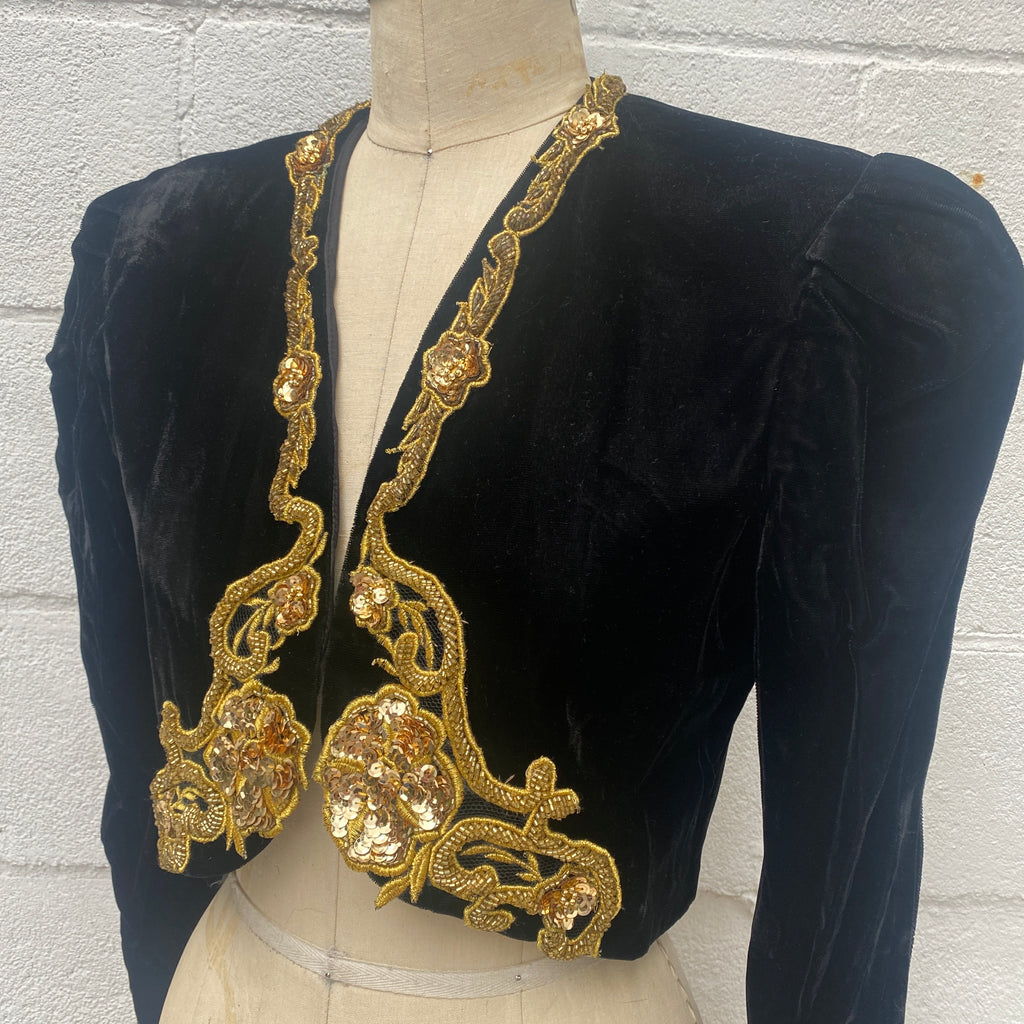 1980s Vintage  Scott McClintock cropped crushed black velvet and gold sequin  and beaded trim Bolero jacket, Large shoulder pads. New with tags, Size Medium.