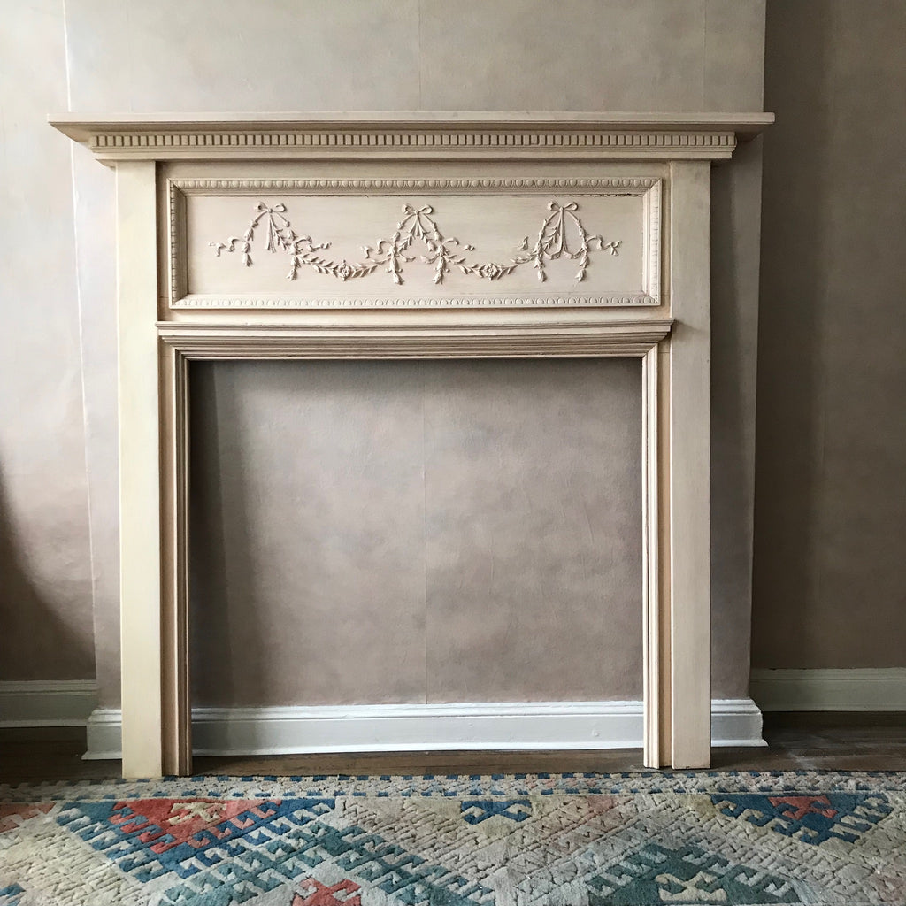Antique French Solid Wood Carved wood Fire Place Mantel painted in cream, located in Astoria Queens NYC